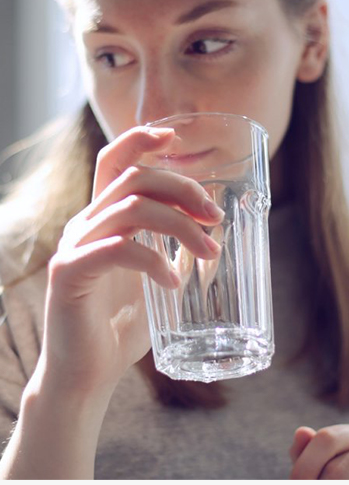 Are there any safety precautions I should take when using a hot and cold water dispenser?
